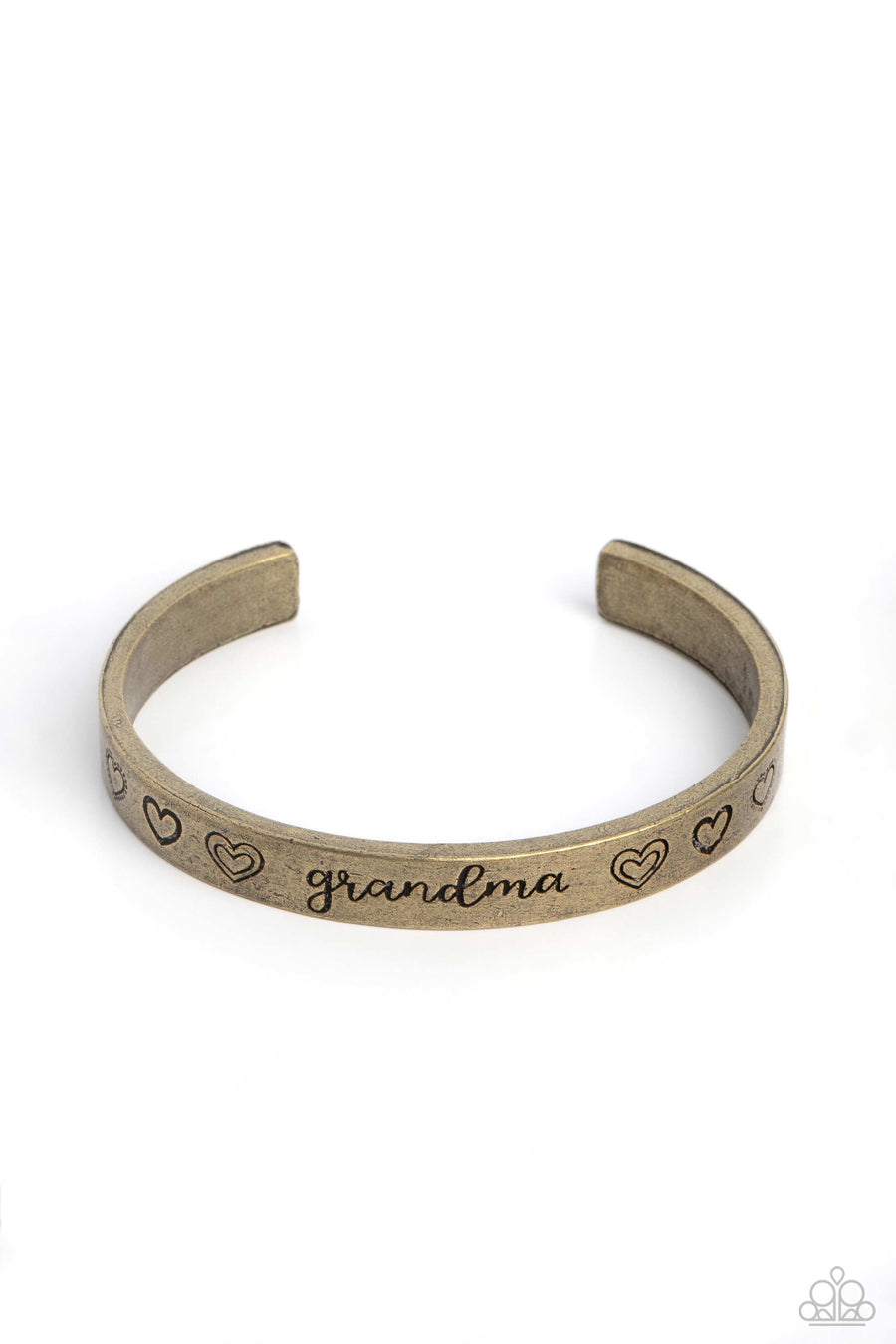 A Grandmothers Love - Brass Bracelet - Paparazzi Accessories - Brushed in an antiqued grit, a skinny brass bar curls around the wrist, creating a rustic cuff. Featuring a heart motif, the skinny cuff is engraved with the word “grandma” with various styles of hearts framing the word for an inspiring, heartfelt finish. Sold as one individual bracelet.