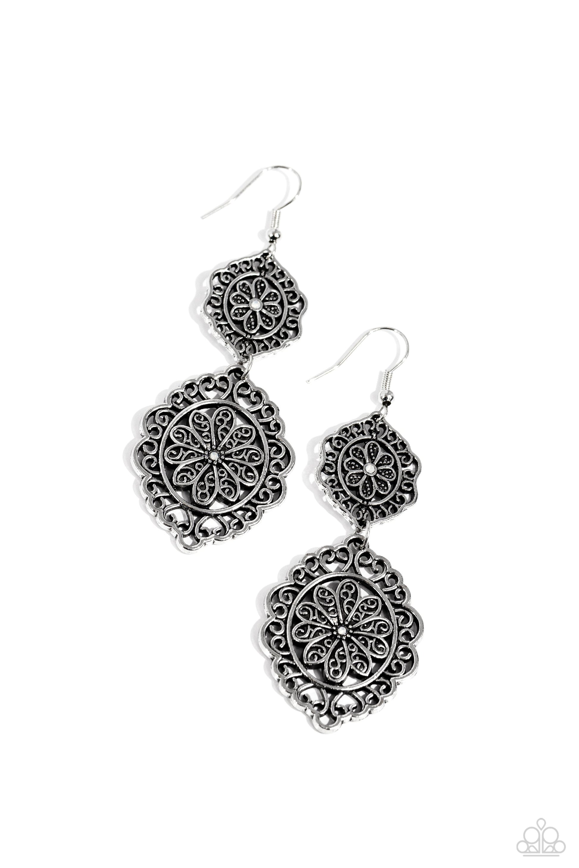 Floral Favorite - White and Silver Earrings - Paparazzi Accessories - Dotted with dainty opal rhinestone centers, a pair of filigree filled silver flowers bloom inside scalloped silver frames that delicately link into a whimsical floral lure.