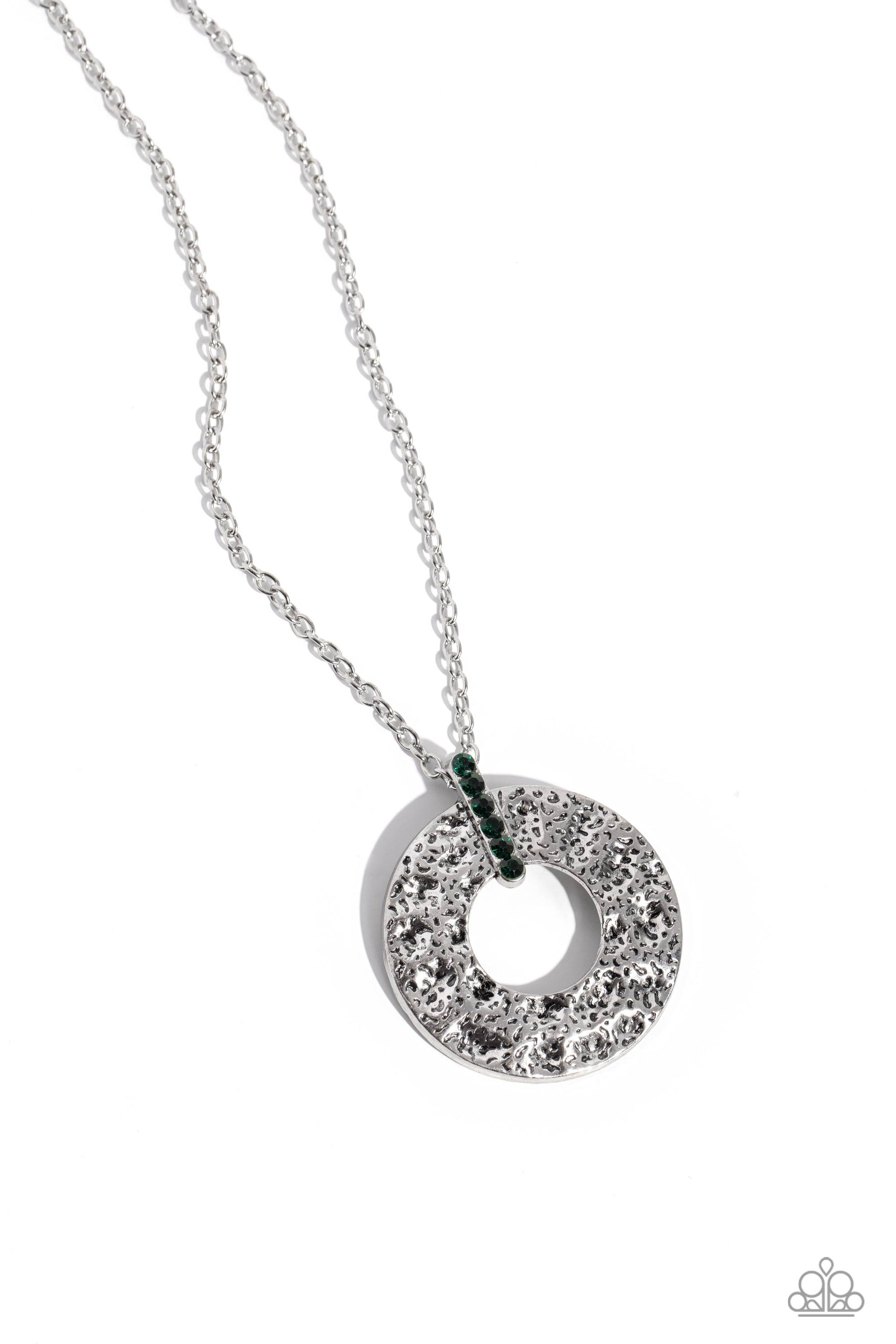 Modern Memento - Green Necklace - Paparazzi Accessories - A stacked row of glittery green rhinestones attaches to a pitted hoop that is hammered in natural inspired patterns, creating a refined relic at the bottom of a lengthened silver chain.