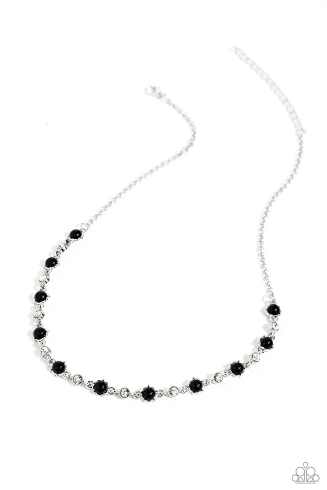 Pronged Passion - Black and Silver Necklace - Paparazzi Accessories - Encased in pronged silver frames, round black beads and white gems delicately connect and alternate below the collar on a dainty silver chain for a seasonal flair.