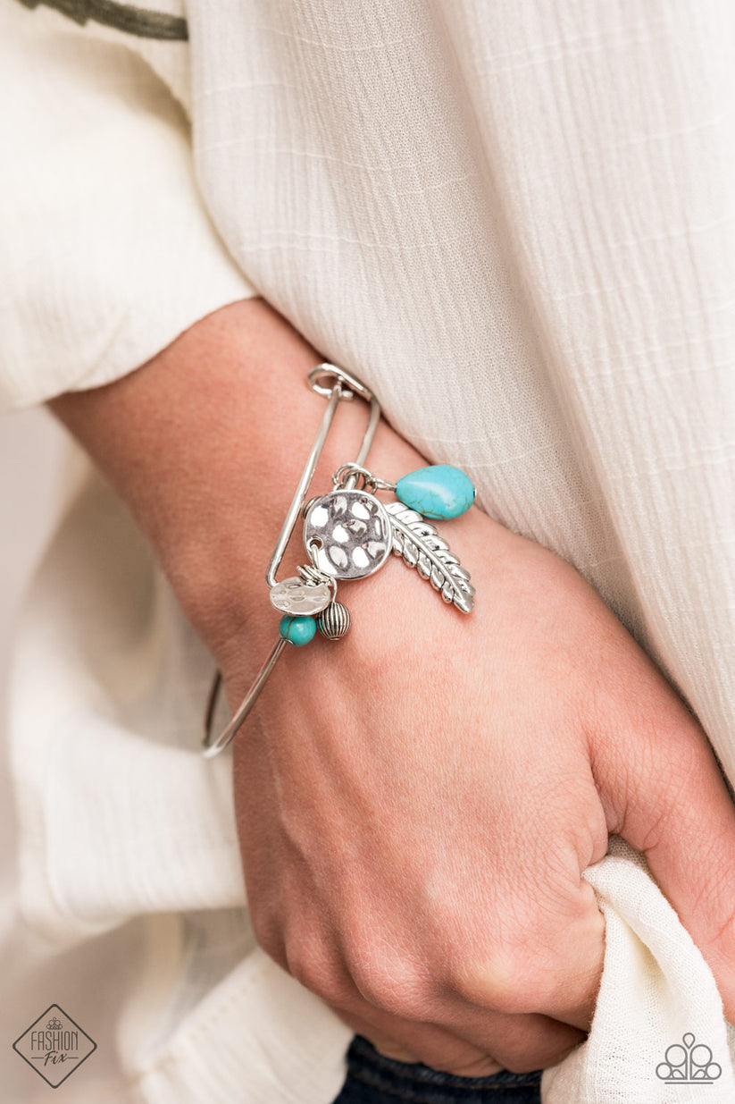 Root and Ranch - Blue Turquoise Bracelet - Paparazzi Accessories - A shimmery silver feather charm, ornate silver beads and earthy turquoise stone beads glide along the fitted center of a dainty silver bangle-like bracelet for a whimsically charming look. Sold as one individual bracelet.