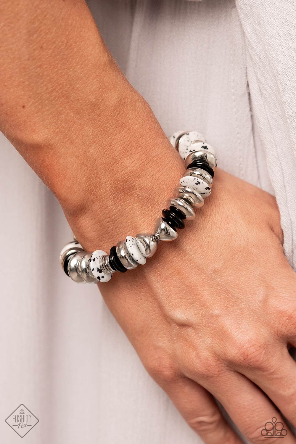 Simply Santa Fe - Black and White Jewelry Set - Paparazzi Accessories - Featuring a black-dotted pattern, abstract white stone discs, black acrylic discs, and various silver discs and accents are threaded along an elastic stretchy band for a high-end, artisanal-inspired look.