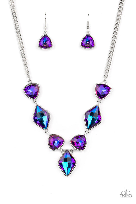 Glittering Geometrics - Purple and Silver Necklace - Paparazzi Accessories - Set in silver frames, glittering geometric purple shapes with a UV shimmer delicately coalesce around the collar for a statement piece. Features an adjustable clasp closure. Due to its prismatic palette, color may vary. Sold as one individual necklace.